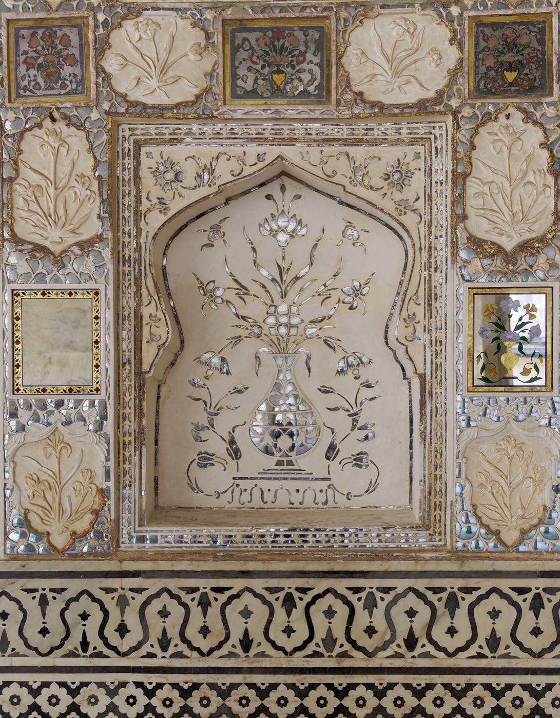 Amber Fort's mirrored halls — Hindu and Mughal in one room.